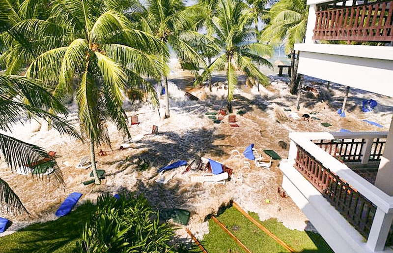 a scattered beach with broken furniture - view from a hotel that was hit by a Tsunami in Thailand in 2004